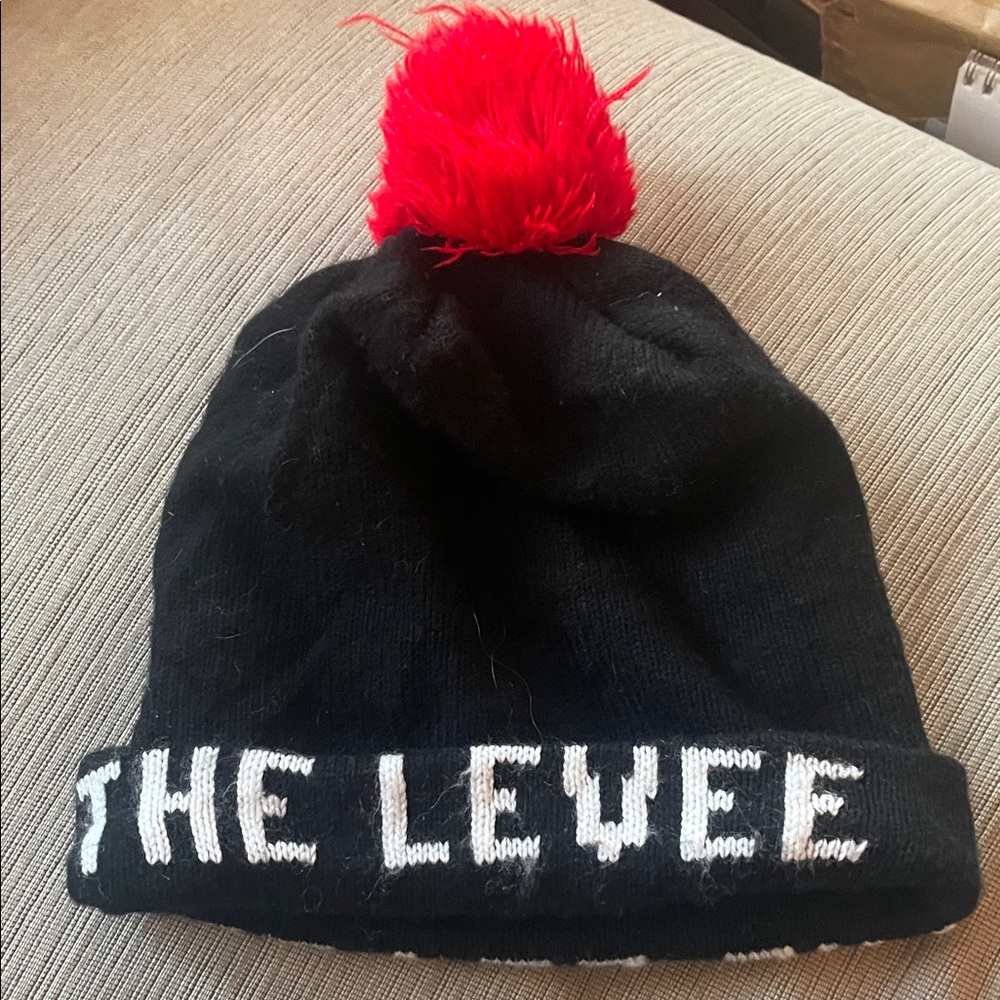 The levee Black Beanie with Red Pom